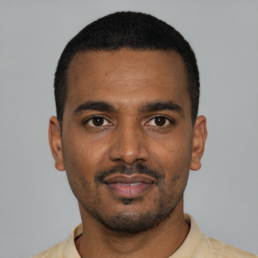 Neutral black young-adult male with short  black hair and brown eyes