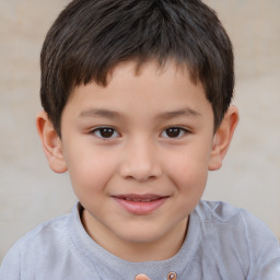 Joyful white child male with short  brown hair and brown eyes