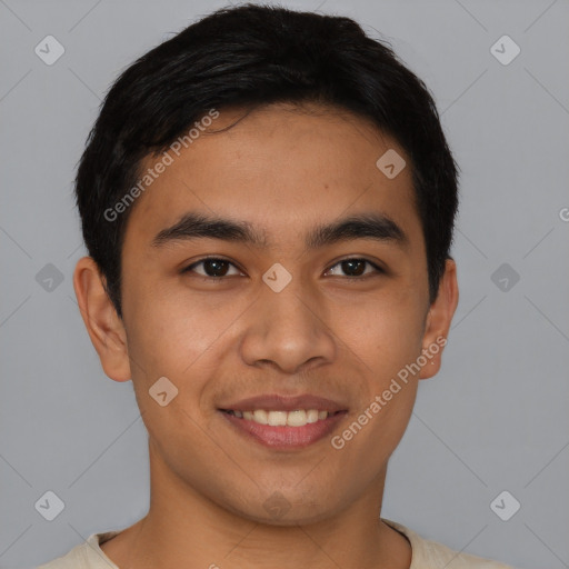 Joyful asian young-adult male with short  black hair and brown eyes