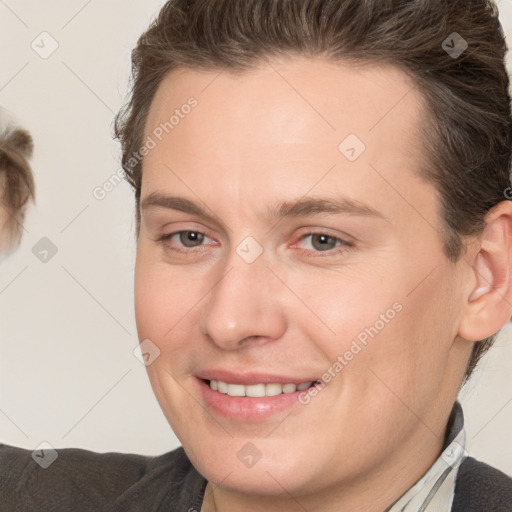 Joyful white adult female with medium  brown hair and brown eyes