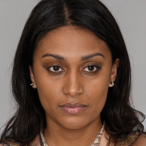 Neutral latino young-adult female with medium  brown hair and brown eyes
