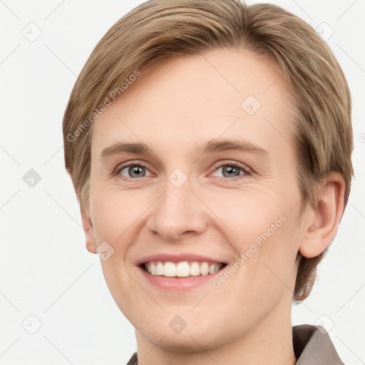 Joyful white young-adult female with short  brown hair and grey eyes