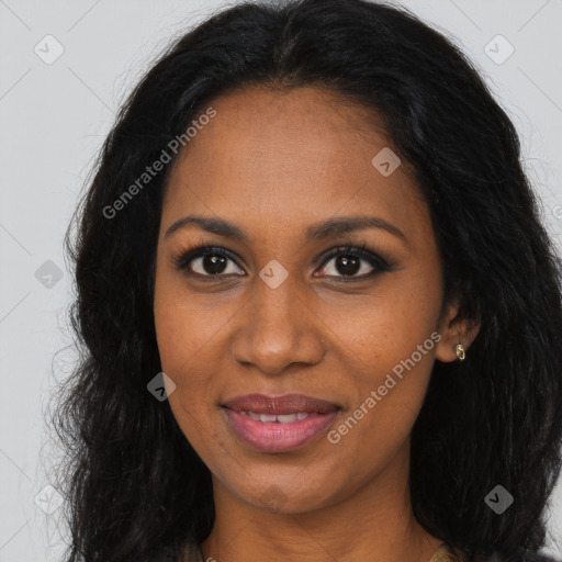 Joyful black adult female with long  brown hair and brown eyes