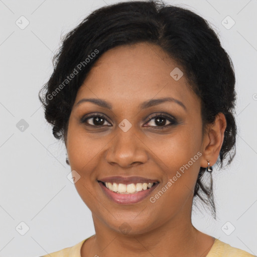 Joyful black young-adult female with long  brown hair and brown eyes