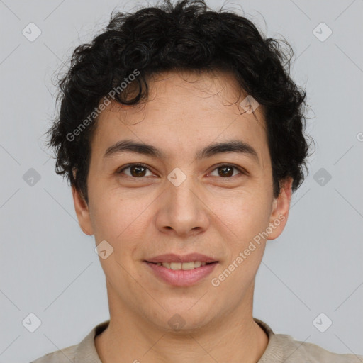 Joyful latino young-adult male with short  brown hair and brown eyes