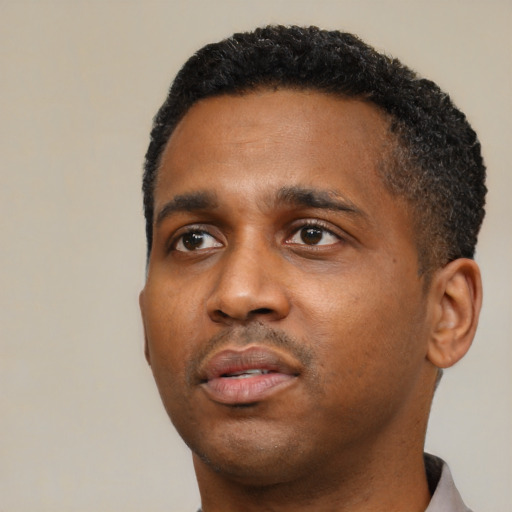 Neutral black young-adult male with short  black hair and brown eyes
