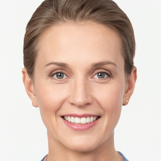 Joyful white young-adult female with short  brown hair and grey eyes