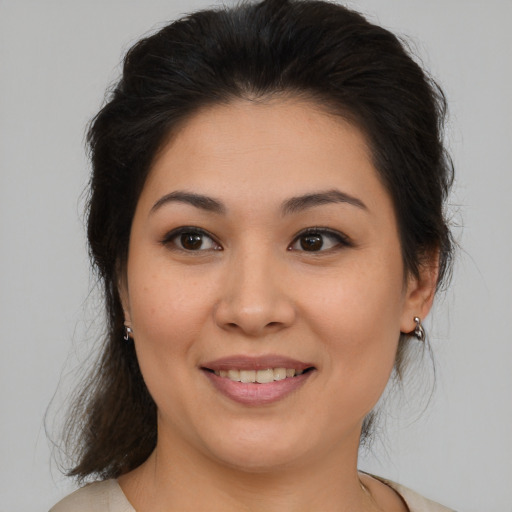 Joyful white young-adult female with medium  brown hair and brown eyes