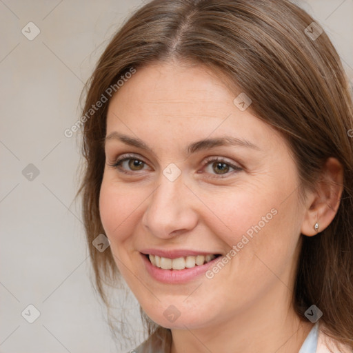 Joyful white adult female with medium  brown hair and brown eyes