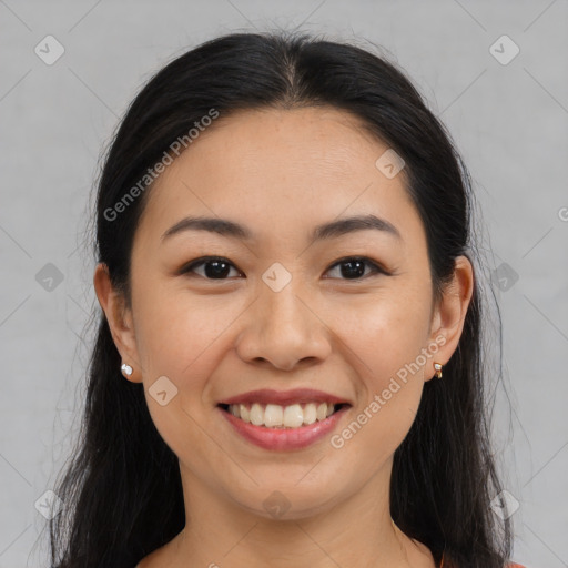 Joyful asian young-adult female with long  brown hair and brown eyes