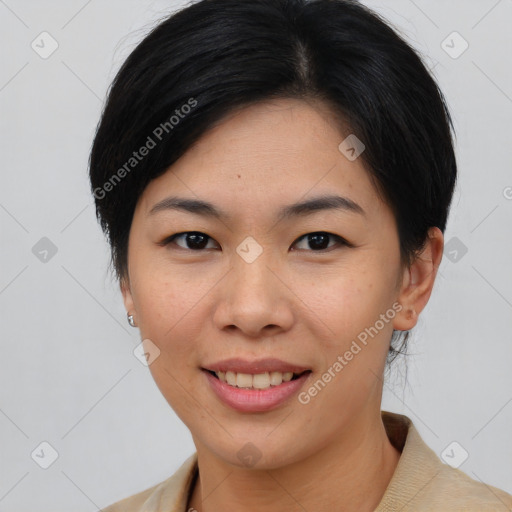 Joyful asian young-adult female with short  brown hair and brown eyes