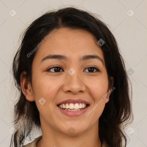 Joyful latino young-adult female with medium  brown hair and brown eyes