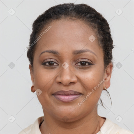 Joyful black adult female with short  brown hair and brown eyes