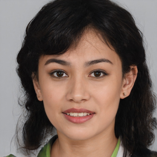 Joyful latino young-adult female with medium  brown hair and brown eyes