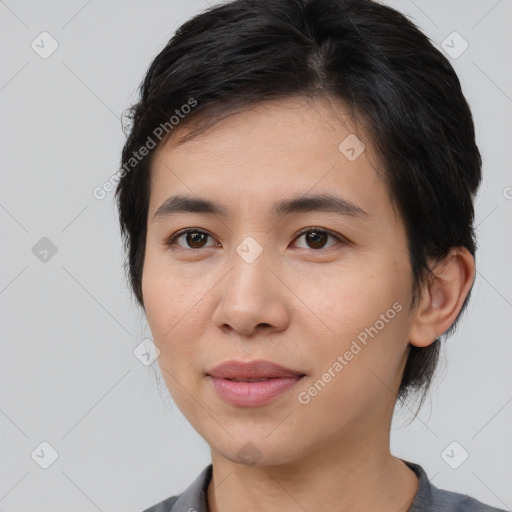 Joyful asian young-adult female with medium  brown hair and brown eyes