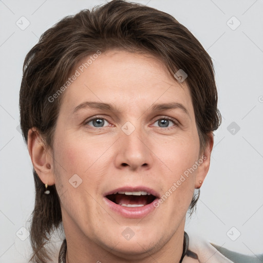 Joyful white adult female with medium  brown hair and grey eyes