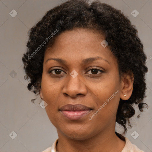 Joyful black adult female with short  brown hair and brown eyes