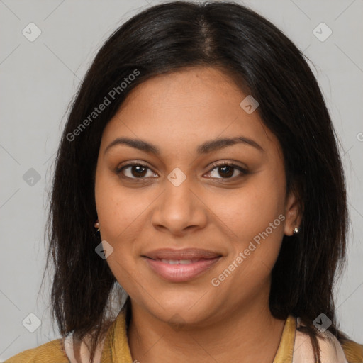 Joyful latino young-adult female with medium  brown hair and brown eyes