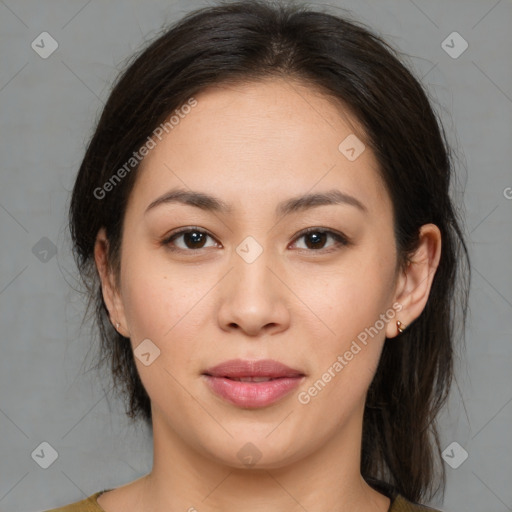 Joyful asian young-adult female with medium  brown hair and brown eyes