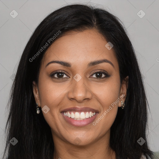 Joyful latino young-adult female with long  brown hair and brown eyes