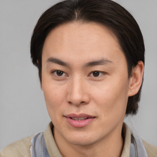 Joyful white adult male with medium  brown hair and brown eyes