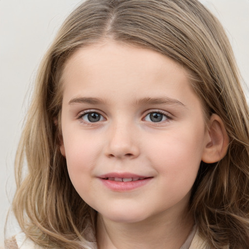 Joyful white child female with long  brown hair and grey eyes