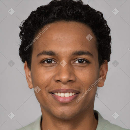 Joyful black young-adult male with short  brown hair and brown eyes