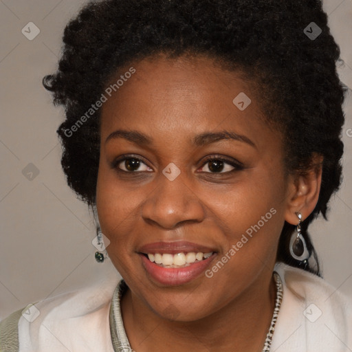 Joyful black young-adult female with long  brown hair and brown eyes