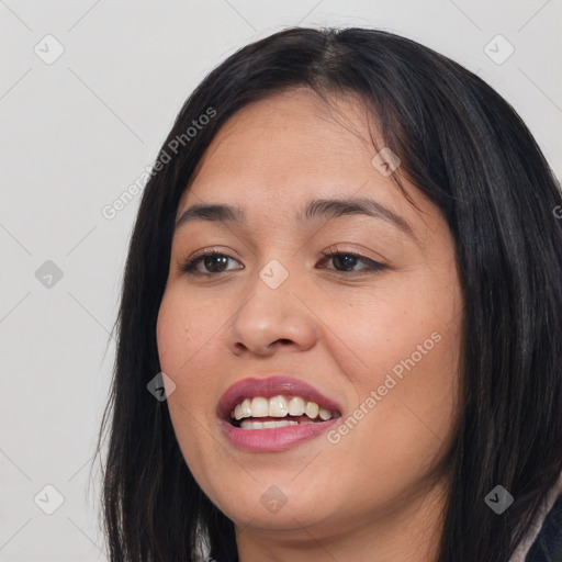 Joyful asian young-adult female with long  brown hair and brown eyes