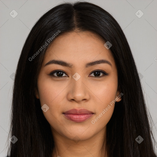 Joyful latino young-adult female with long  black hair and brown eyes