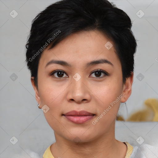 Joyful asian young-adult female with short  black hair and brown eyes