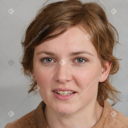 Joyful white young-adult female with medium  brown hair and blue eyes