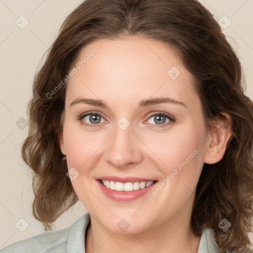 Joyful white young-adult female with medium  brown hair and green eyes