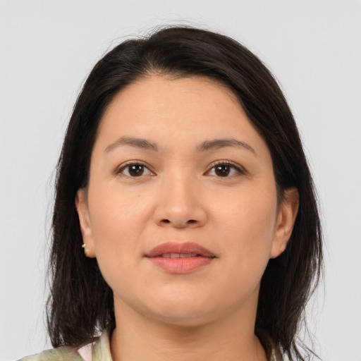 Joyful asian young-adult female with medium  brown hair and brown eyes