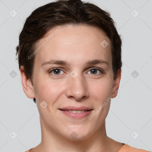 Joyful white young-adult female with short  brown hair and grey eyes