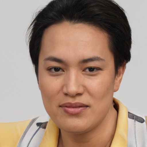 Joyful asian young-adult female with short  brown hair and brown eyes