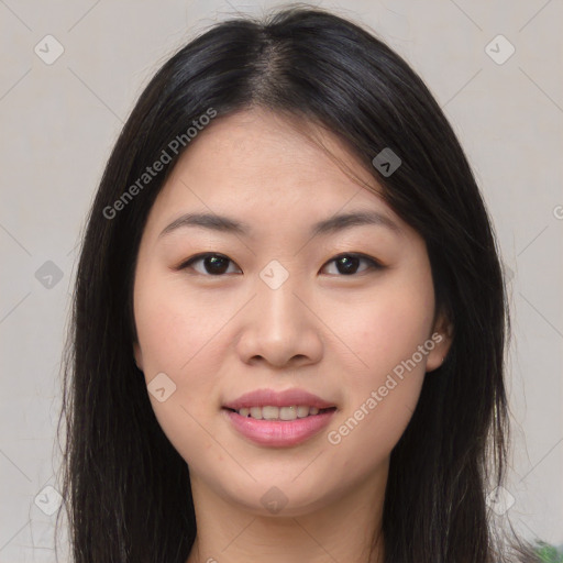 Joyful asian young-adult female with long  brown hair and brown eyes