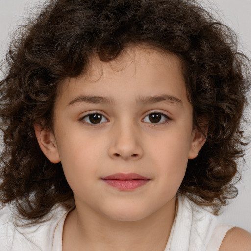 Joyful white child male with medium  brown hair and brown eyes