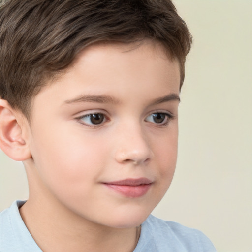 Joyful white child male with short  brown hair and brown eyes