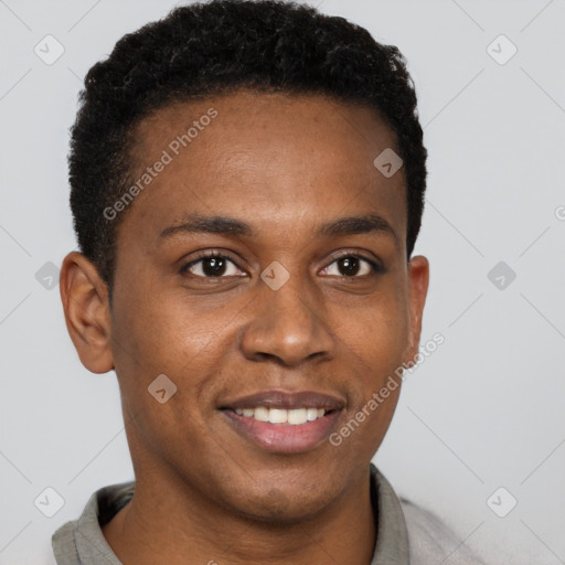 Joyful black young-adult male with short  brown hair and brown eyes