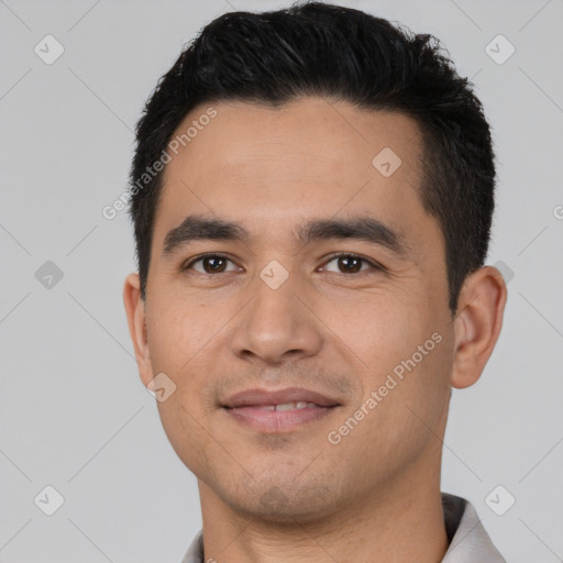 Joyful white young-adult male with short  black hair and brown eyes