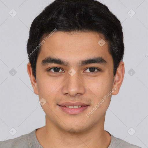 Joyful white young-adult male with short  black hair and brown eyes