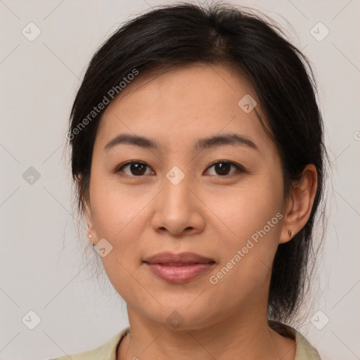 Joyful latino young-adult female with medium  brown hair and brown eyes