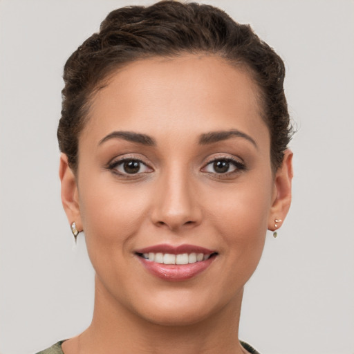 Joyful white young-adult female with short  brown hair and brown eyes