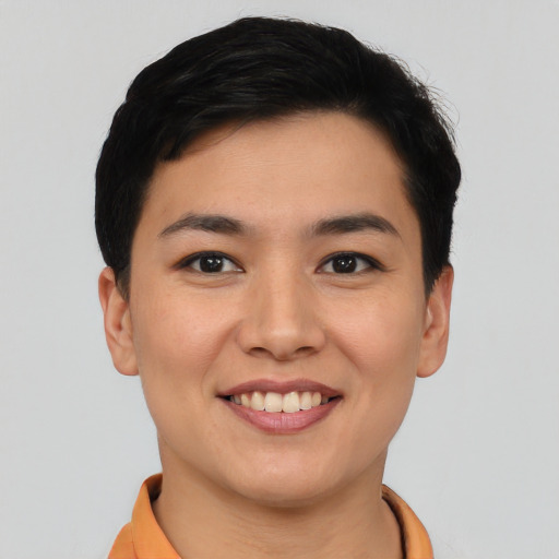 Joyful asian young-adult female with short  black hair and brown eyes