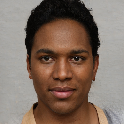 Neutral black young-adult male with short  black hair and brown eyes