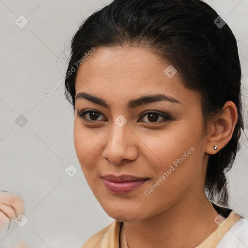 Joyful latino young-adult female with medium  brown hair and brown eyes