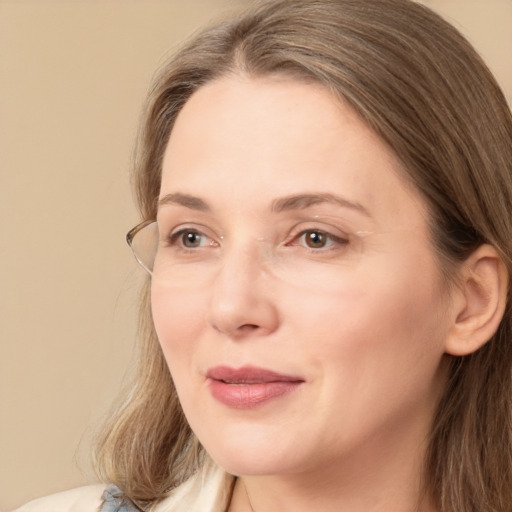 Joyful white adult female with long  brown hair and brown eyes