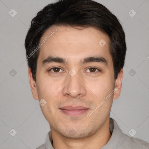 Joyful white young-adult male with short  black hair and brown eyes