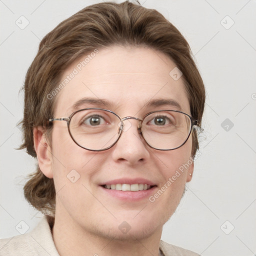 Joyful white adult female with short  brown hair and grey eyes